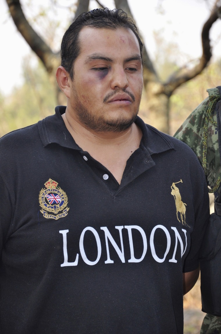 Image: Suspect Victor Valdez, known as \"El Gordo Varilla\" (The Big Stick) is being presented to the media in Cuernavaca