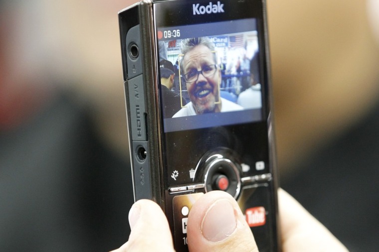 Image: An interview with Freddie Roach is recorded on a Kodak Zi8 HD pocket video camera before a media workout for Pacquiao in Los Angeles