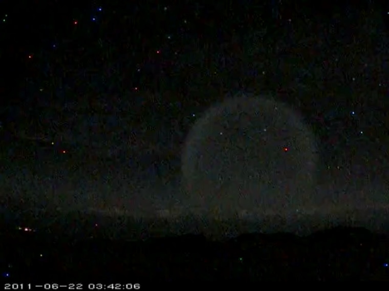 Two telescopes in Hawaii caught this mysterious burst in the sky on film. The sight is likely that of a test missile venting fuel in the upper atmosphere.