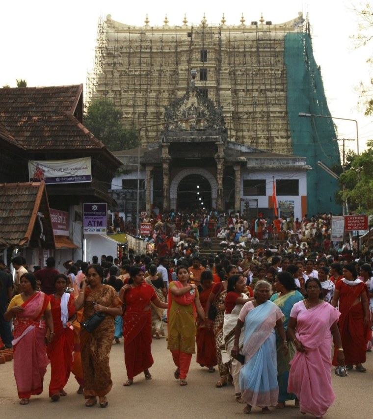 Image: Devotees leave Sree Padmanabhaswamy temple after offering prayers on the eve of Pongala festival in Thiruvananthapuram