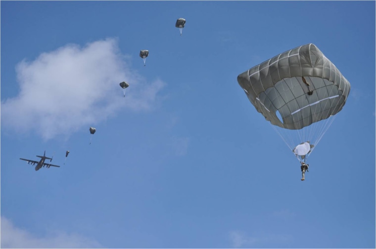 Airborne School students at Fort Benning, Ga., complete the first jump using the Army's new T-11 parachute on March 16, 2010.