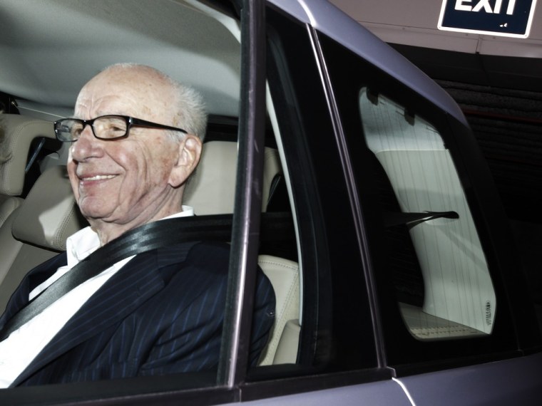 Image: News Corp chairman Rupert Murdoch leaves the offices of News International in London