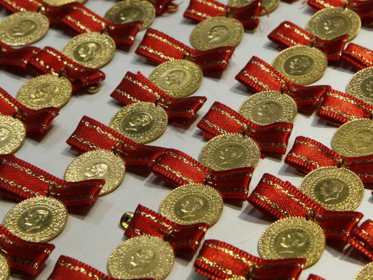 Image: Gold sovereigns, portraying modern Turkey's founder Ataturk, are seen on sale at a jewellery shop in Istanbul
