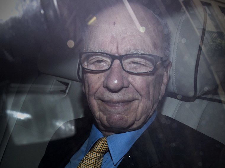 Image: News Corporation Chief Rupert Murdoch leaves his London home on July 20