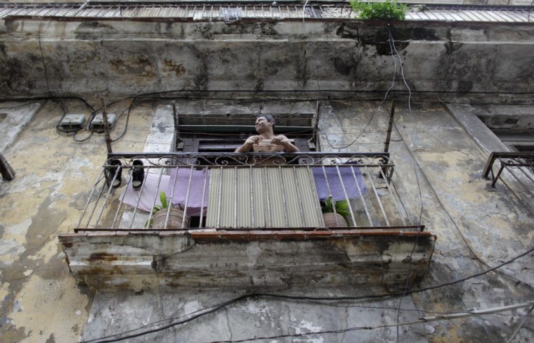 Image: A man on his balcony in Cuba