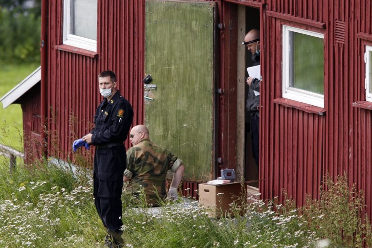 Image: Members of the police and army carry out searches on a farm rented by Anders Behring Breivik in the small rural region of Rena