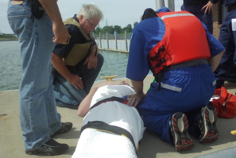 Crews tend to Michael Trapp after his rescue. Sheriff’s officials said the pilot spent more than 17 hours in the water after his plane went down in Lake Huron.