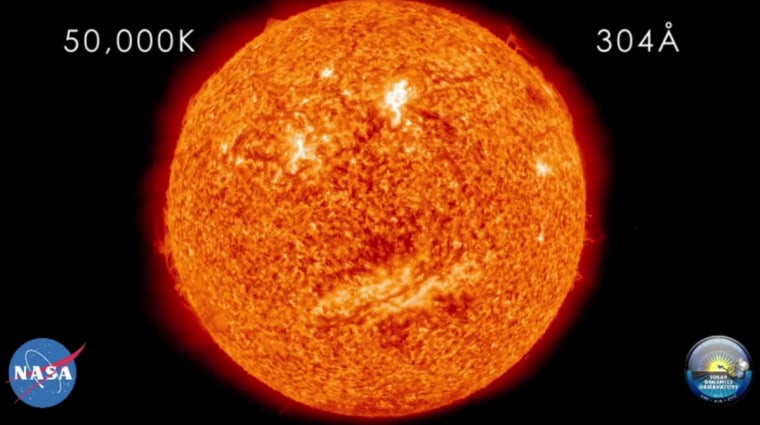 This still photo from a NASA video shows an apparent smiley face on the sun as seen by the Solar Dynamics Observatory. The solar happy face is seen in different wavelengths in a video posted on July 25.