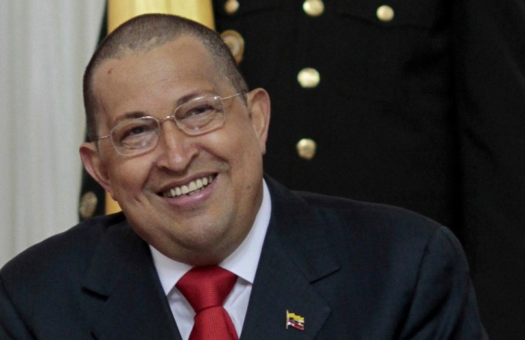 Image: Venezuelan President Hugo Chavez appears with a new hair cut due to his cancer treatment in Caracas