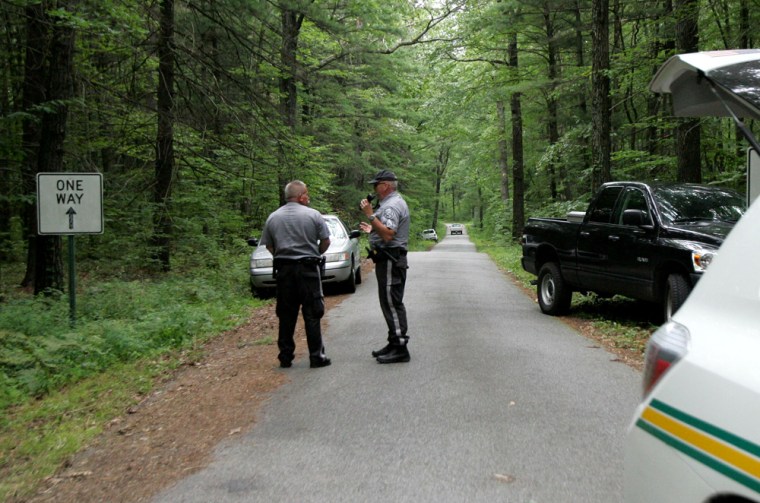 Image: The entrance to the Appalachian Trail is blocked off by New Jersey Park Police Sgts. Mann and Townsend