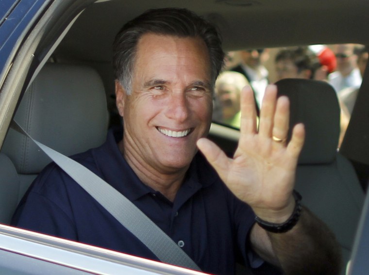 Image: U.S. Republican presidential candidate and former Massachusetts Governor Romney waves as he leaves a campaign stop in Los Angeles