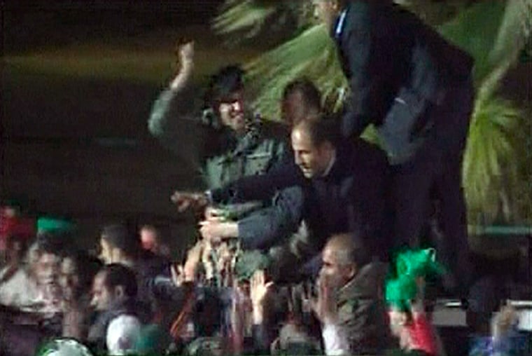 Still image from video dated March 29, 2011 shows a man resembling Khamis Gadhafi, the son of Libyan leader Moammar Gaddafi, greeting a crowd
