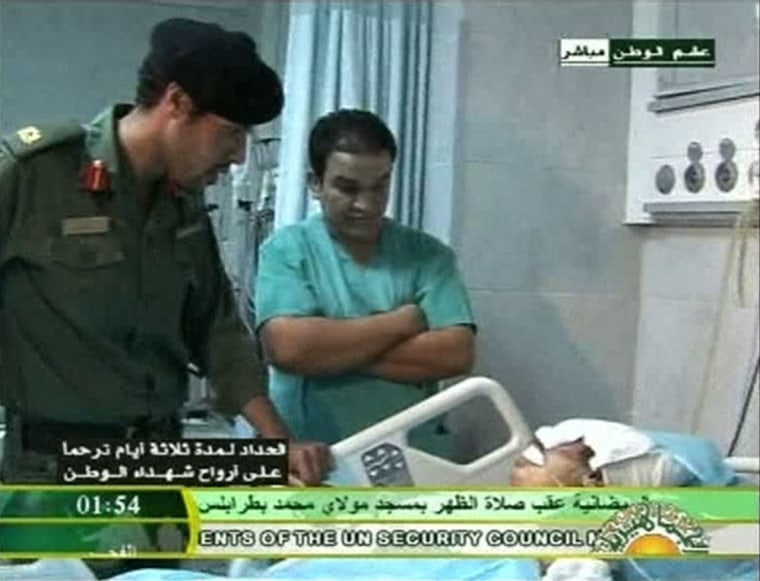 Image: Still image from video footage by Libyan state television shows what it says is Muammar Gaddafi's son Khamis visiting wounded Libyans in a hospital
