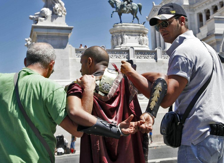 Modern-day gladiator impersonators are arrested outside the Colosseum in Rome.
