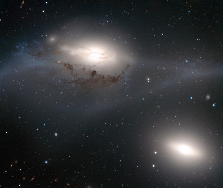 This striking image, taken with ESO's Very Large Telescope, shows a beautiful yet peculiar pair of galaxies, NGC 4438 (top) and NGC 4435, nicknamed The Eyes. The two galaxies belong to the Virgo Cluster and are about 50 million light-years away.