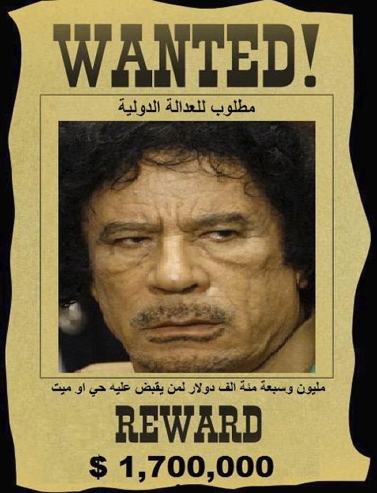 Image: A wanted poster for Moammar Gadhafi distributed by opposition group Al-Manara media