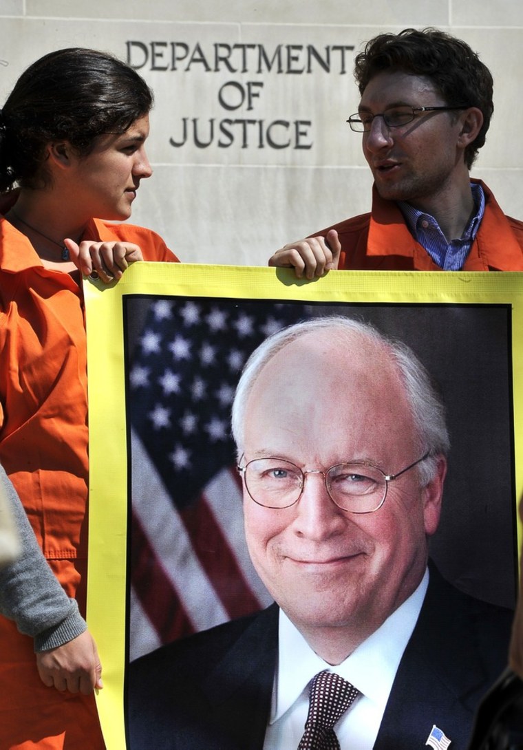 Image: Activists representing Amnesty International hold banners with the portrait of former US Vice President Dick Cheney during a demonstration in front of the Justice Department