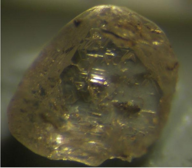 A raw diamond from Juina, Brazil, with a small window polished into it to see if any inclusions are inside.