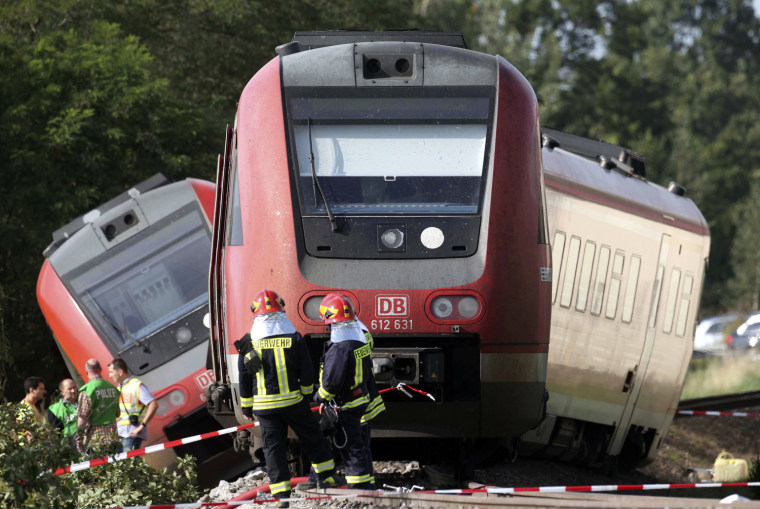 Image: Firefighters stand in front of a derailed train in Bad Lausick near Leipzig, eastern Germany,