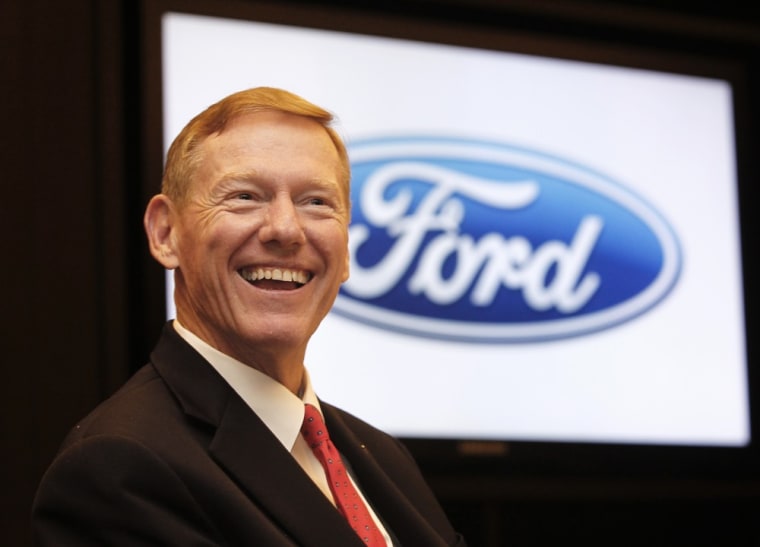 Image: Ford Motor Co President and CEO Alan Mulally smiles during an interview in Bangkok
