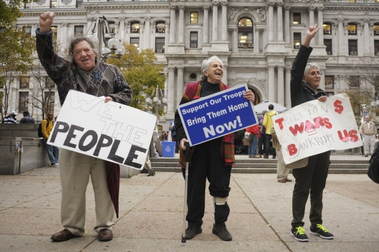 Image: Gary Laison, his wife Diane Laison and Joan Kosloff, all of Philadelphia, take part in the Occupy Philadelphia protest