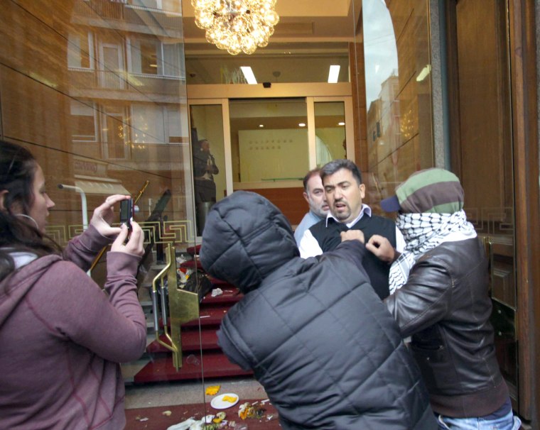 Image: Italian students protest at the Goldman Sachs headquarters in Milan