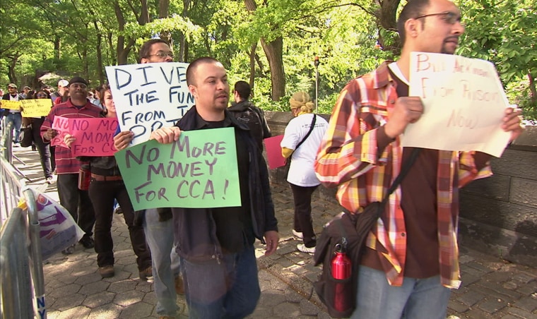 Dozens of people gathered in New York City in May, 2011 to protest hedge funds investing in private prison companies like Corrections Corporation of America and The GEO Group. 