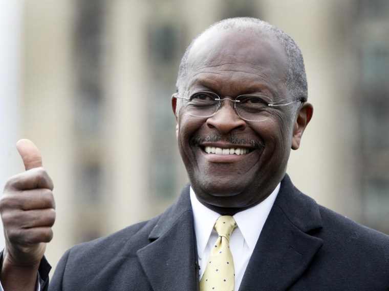 Image: Republican Presidential candidate Herman Cain gestures to the crowd during a campaign stop to launch his \"Economic opportunity zone plan\" in front of the empty, closed Michigan Central Train Station in Detroit,
