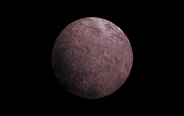 This artist's conception shows 2007 OR10, nicknamed Snow White. Astronomers suspect that its rosy color is due to the presence of irradiated methane.