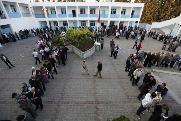 Image: Voters wait at polling station in Tunis