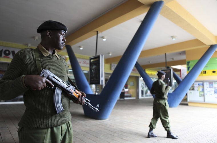Image: An administration policeman keeps guard outside a shopping mall in the suburbs of capital Nairobi