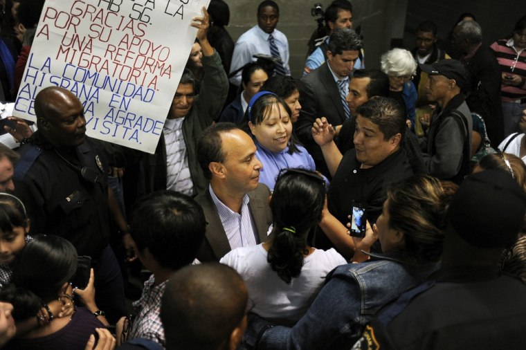 Image: Opponents of Alabama immigration law stage rally at Fair Park Arena