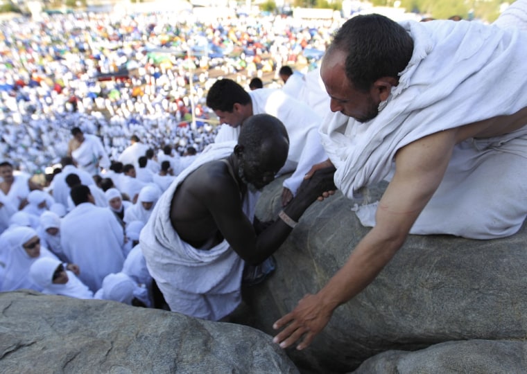 Image: Muslim pilgrims on the Mountain of Mercy near Mecca, Saudi Arabia