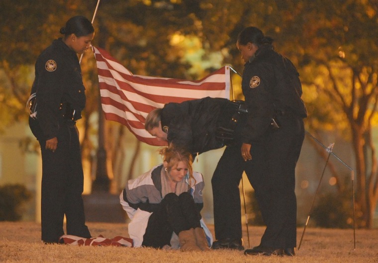 Image: A lone member of the Occupy Atlanta movement is arrested by members of the Atlanta Police Department at Woodruff Park early on Monday