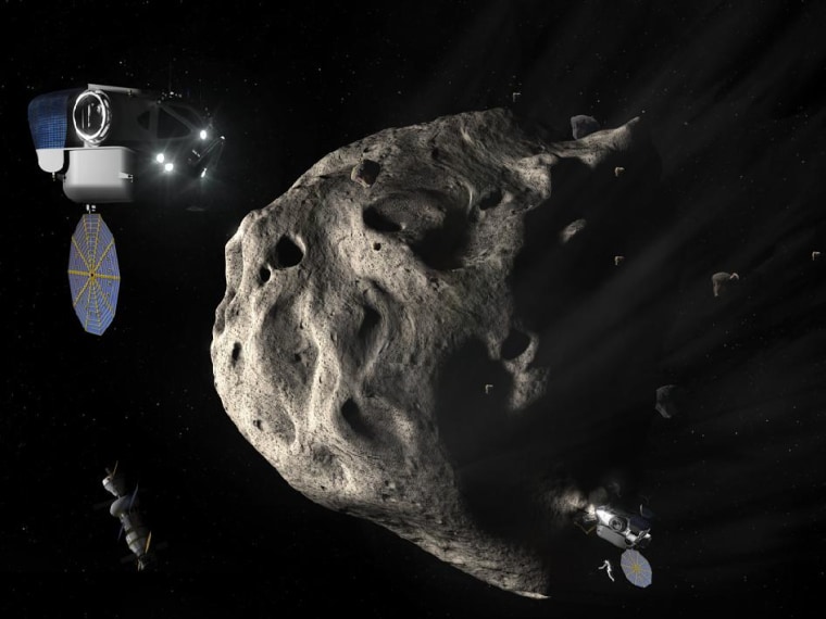 Twin Space Exploration Vehicles approach an asteroid with the Multi-Person Crew Vehicle docked to a habitat in the background.