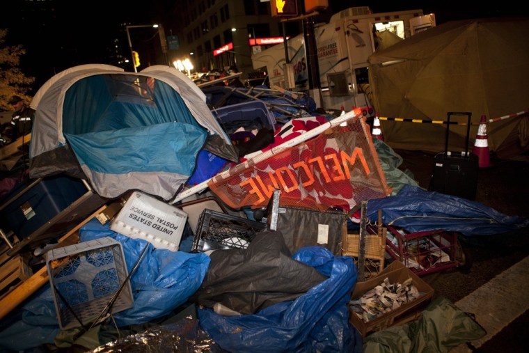 Image: Trash is piled high near Zuccotti Park, Occupy Wall Street's longtime encampment in New York, during the cleanup effort early Tuesday.