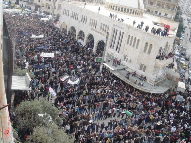 Image: Demonstrators against Syria's President Bashar al-Assad take part in a march after Friday prayers in Kafranbel near Adlb