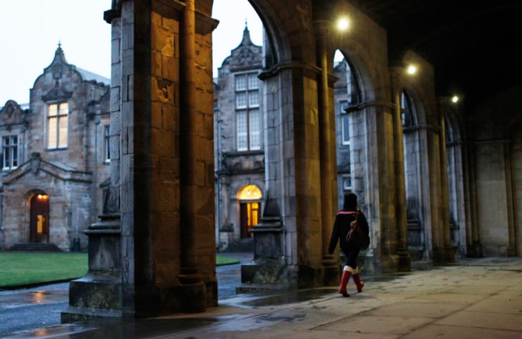 A student walks in the grounds of St Andrews University, Scotland.