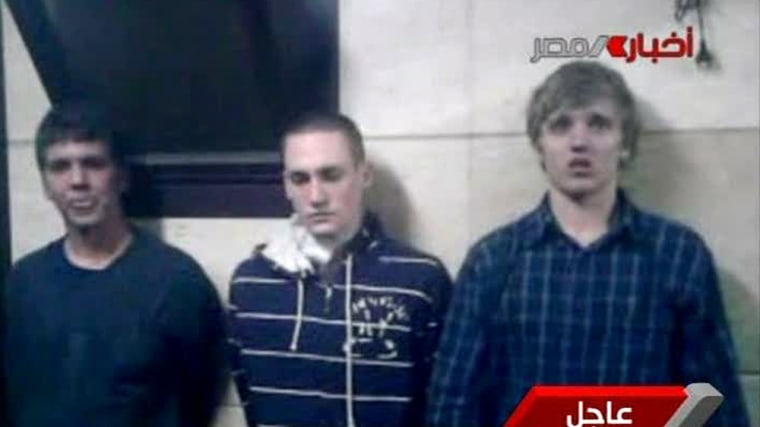 Three American students are displayed to the camera by Egyptian authorities following their arrest during protests in Cairo on Nov. 22.