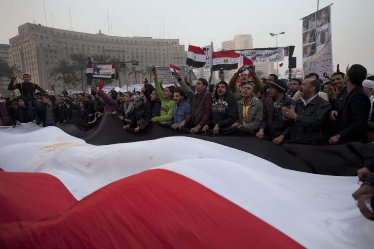 Image: Protester chant slogans against Field Marshal Hussein Tantawi in Tahrir Square in Cairo, Egypt, Friday
