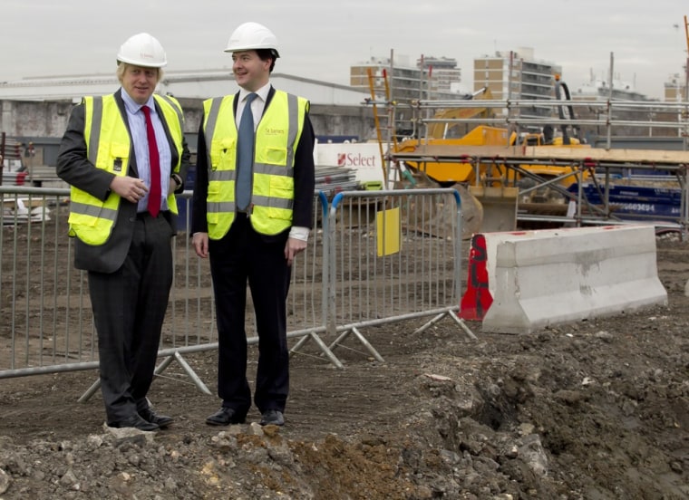 Image: Britain's Chancellor of the Exchequer George Osborne, right, and London Mayor Boris Johnson pose for photographers during their visit the Riverlight construction site in central London