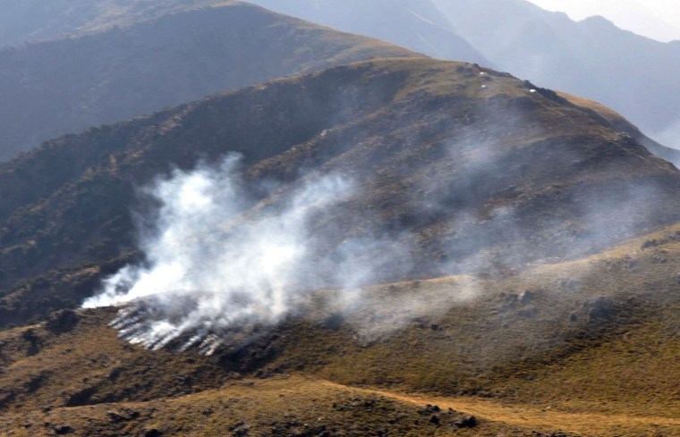 Image: smoke rising apparently after a cross-border NATO air strike on Pakistani border posts
