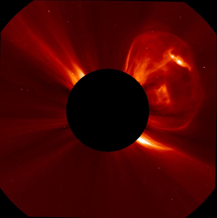 A coronal mass ejection (CME) bursting off the left side of the sun. This image was captured by the Solar and Heliospheric Observatory (SOHO) on Sept. 21.