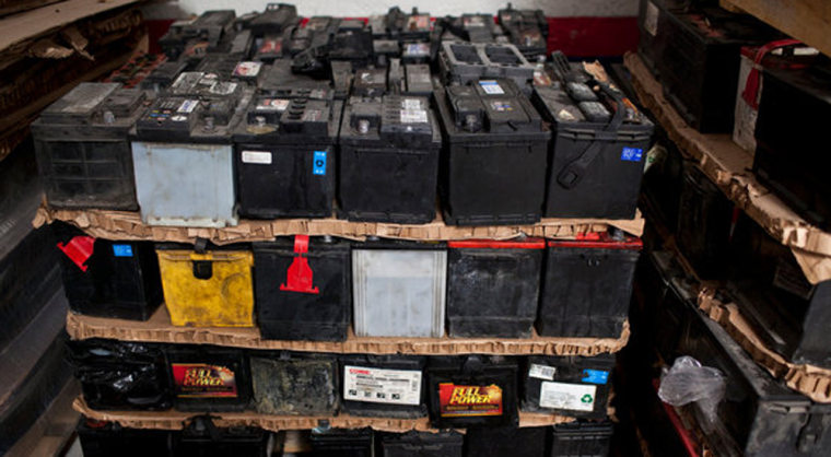 Automotive batteries are stacked inside a distribution center in Mexico City.