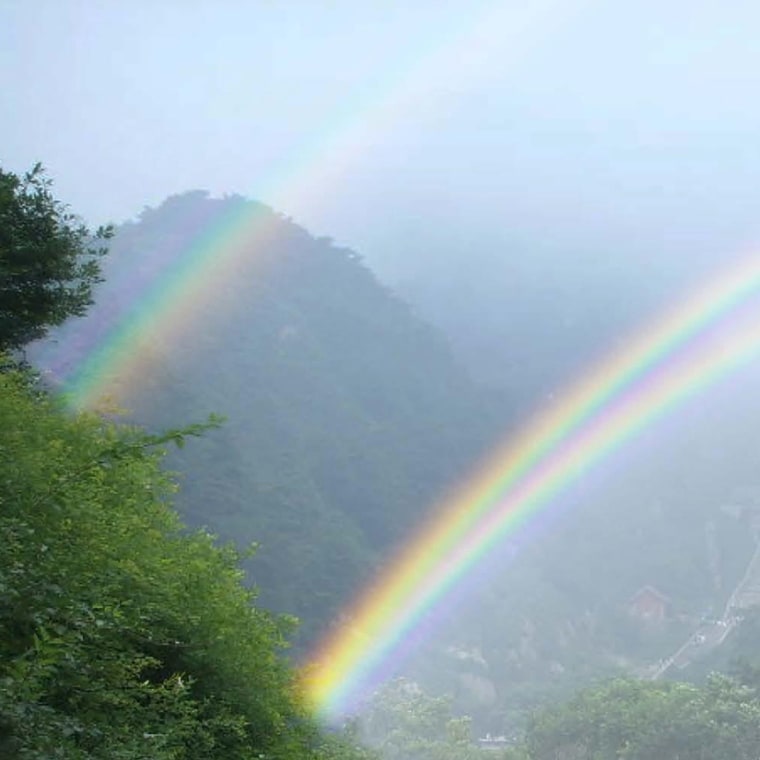 A picture, produced through computer simulation, showing a twinned rainbow. The rainbow is split because of the interaction of light with two types of water drops.