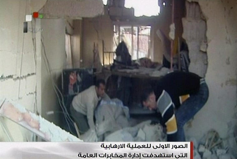 Image: Syrian TV image grab of the site of a bomb attack