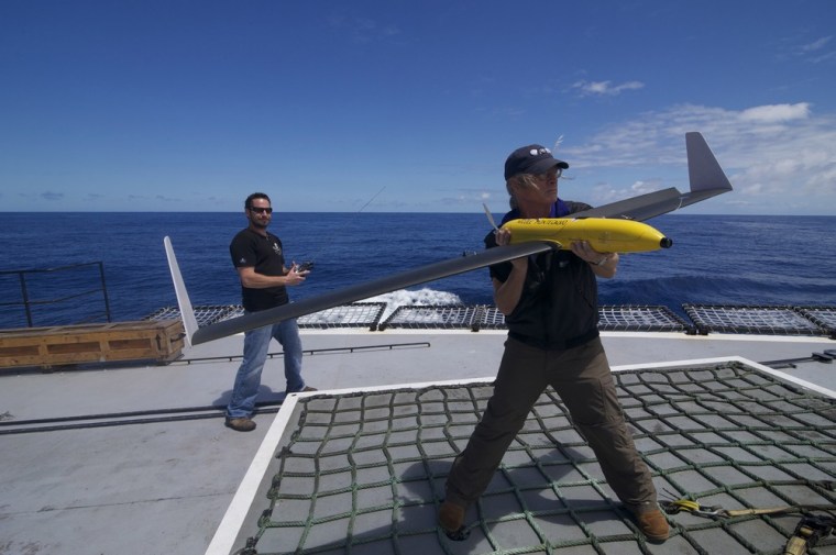 Image: Handout picture of second mate Brown holding a pilotless drone aircraft on the deck of the Sea Shepherd Conservation Society ship, Steve Irwin, off Australia's western coast