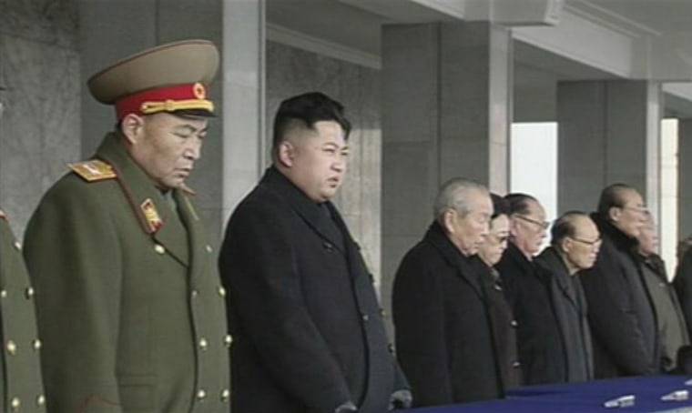 Image: Frame grab shows North Korea's new leader Kim Jong-un looking on next to Chief of General Staff of the Korea People's Army Ri Yong-ho during the memorial for late North Korean leader Kim Jong-il in Pyongyang