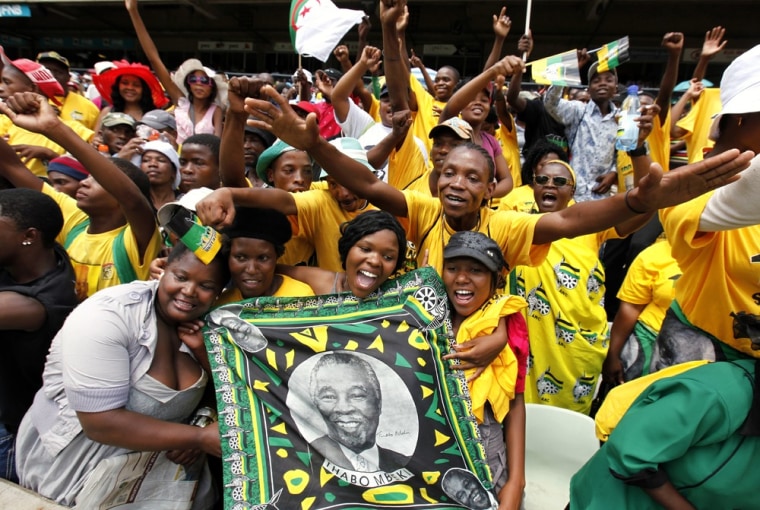 Image: ANC supporters hold a picture of Thabo Mbeki in Bloemfontein, South Africa
