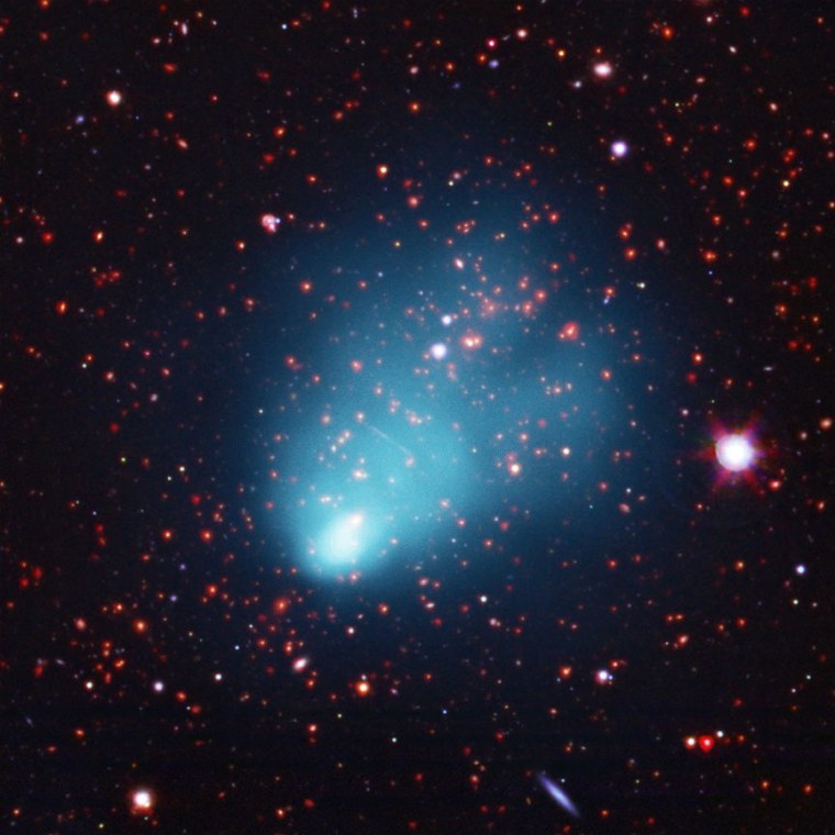 A composite image shows El Gordo in X-ray light from NASA's Chandra X-ray Observatory in blue, along with optical data from the European Southern Observatory's Very Large Telescope (VLT) in red, green and blue, and infrared emission from the NASA's Spitzer Space Telescope in red and orange. Image released Jan. 10.